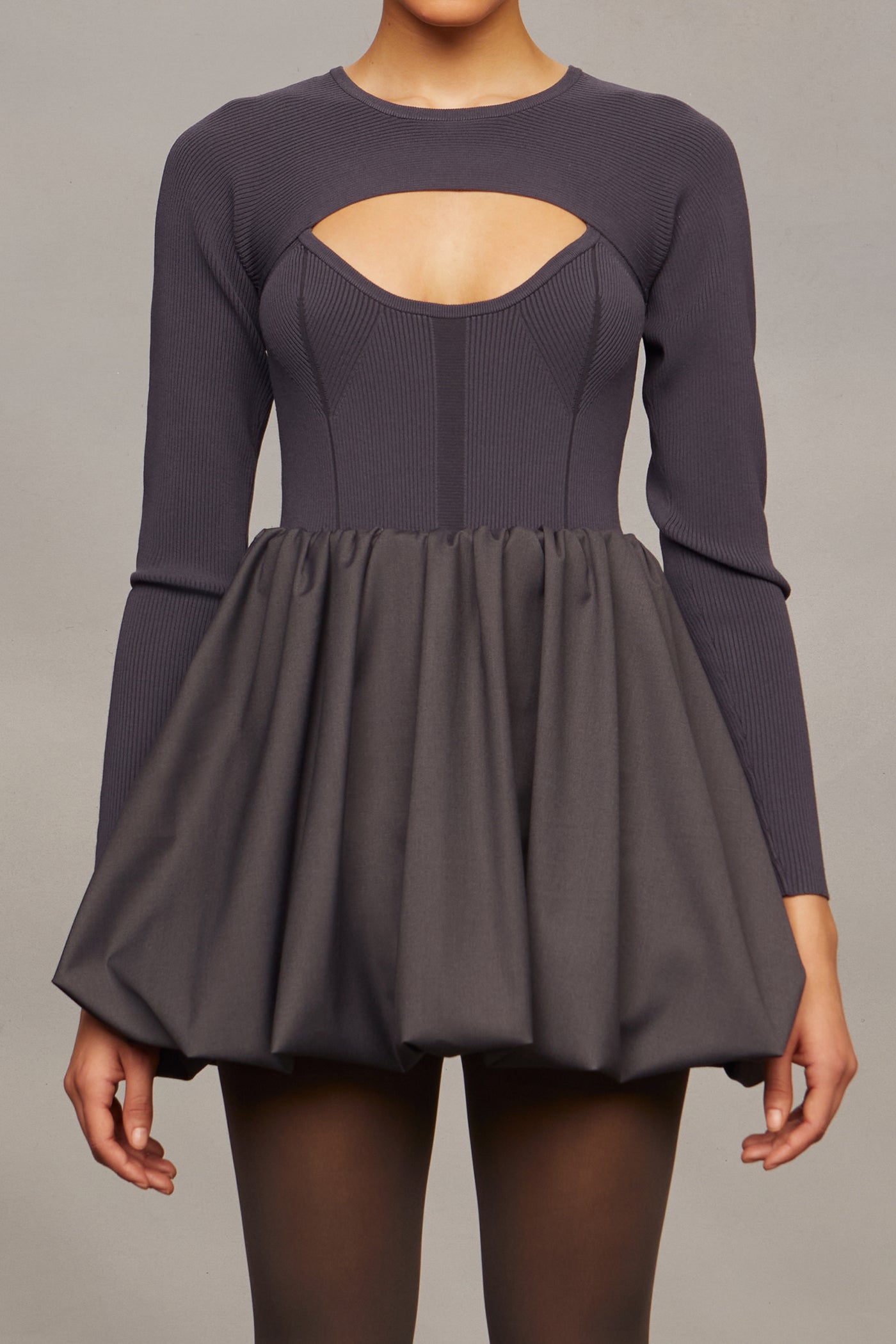 Gray dress with cutout design on a plain background