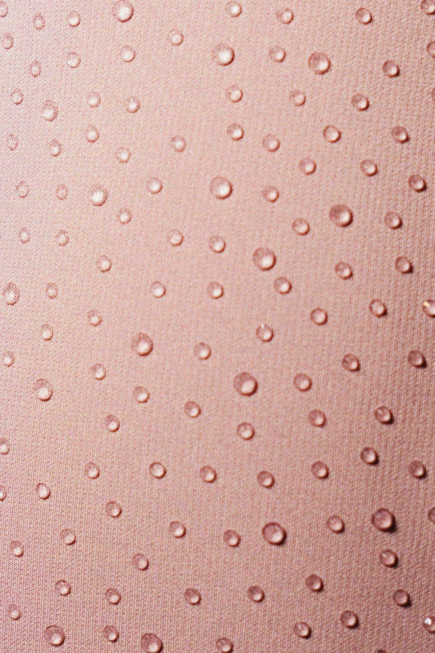 Close-up of pink fabric with a textured pattern